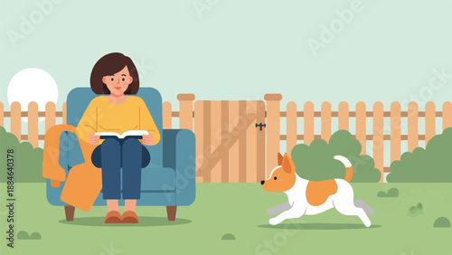 Woman relaxing in chair reading book while dog plays in fenced yard