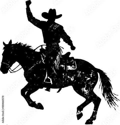 Cowboy riding a bucking horse with one arm raised during rodeo performance