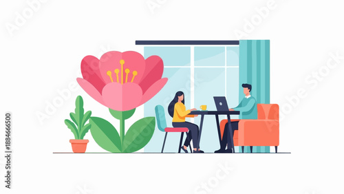 Two people working on laptops by a large flower