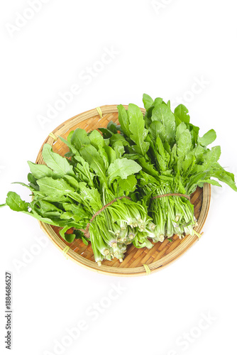 Fotografi Fresh Yunnan Greens in Woven Basket - Organic Leafy Vegetables