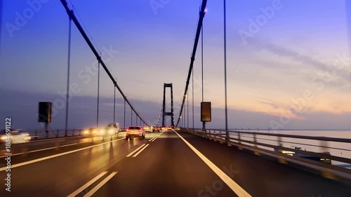 Great Belt Bridge sunset drive with wind turbines, Denmark