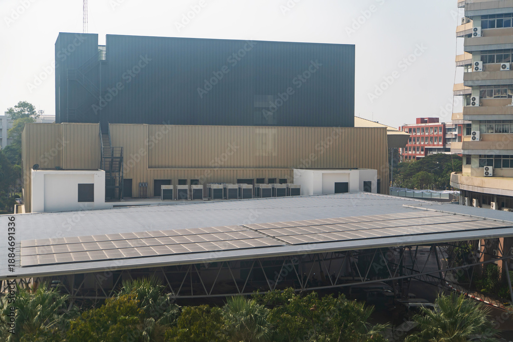 Obraz premium Modern Building with Solar Panels on Roof