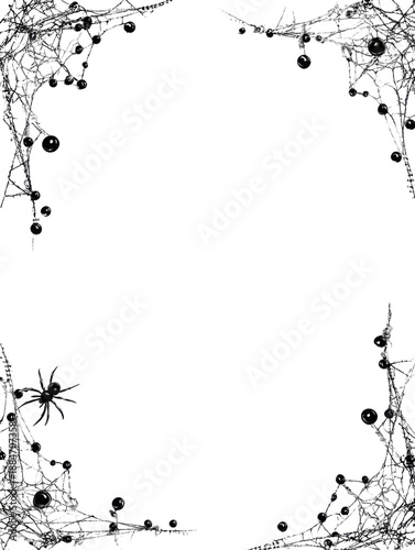 Intricate spider web border with water droplets on black background