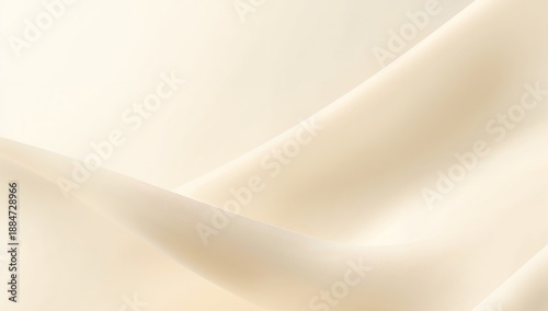 A close-up view of smooth, cream-colored fabric with gentle folds and soft lighting.