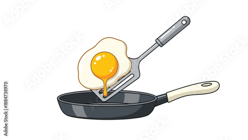 A perfectly fried egg with a runny yolk rests on a metal spatula, poised above a black frying pan, ready to be served for breakfast or brunch.