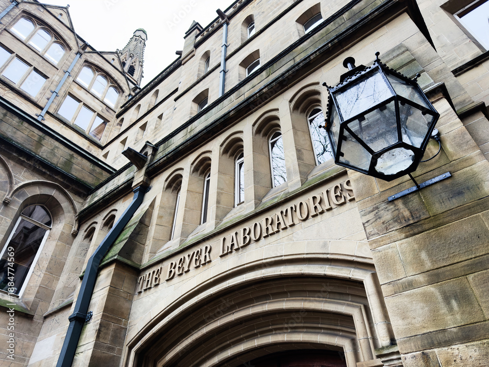 Naklejka premium Exterior view of The Beyer Laboratories entrance on historic Manchester, UK building
