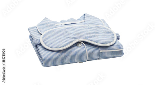 Elegant blue striped pajamas set with sleep mask on a minimalist white background