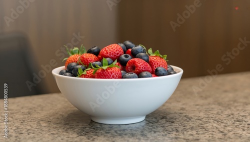 Bowl of Fresh Strawberries and Blueberries on a Kitchen Counter