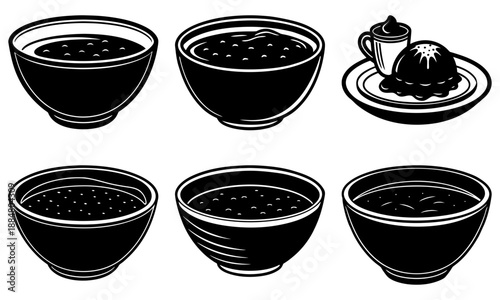 Black bowls of food and a chocolate dessert on a plate are served.