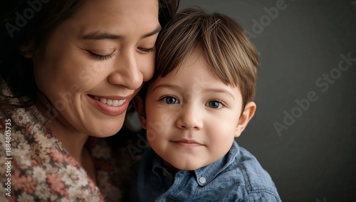 Mother and Son Share a Moment of Joy in a Cozy Indoor Setting During the Afte...