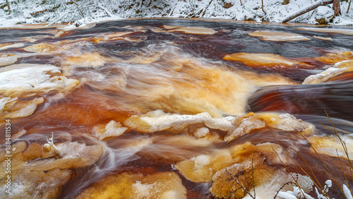 Bild auf Leinwand Close-up view of the turbulent stream and rapids of the Roshchinka River with br