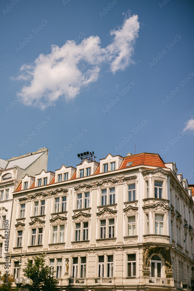 Fototapeta premium Building with ornate details under a clear blue sky in an urban setting during daytime