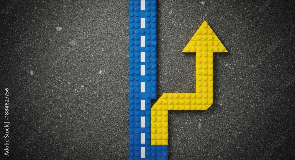 Fototapeta premium Road to Success: A Lego Brick Arrow Pointing Upward on a Textured Background