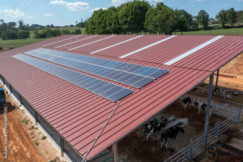 Modern dairy farm barn using solar panels for sustainable agriculture
