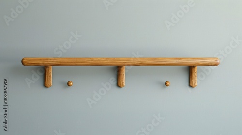 A photo of a simple wooden coat rack with no decorations.