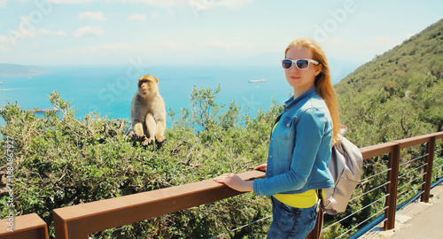 Woman tourist and macaque monkey. Gibraltar