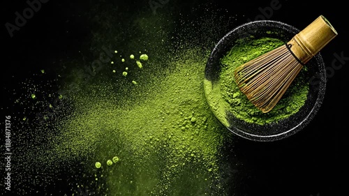 Aerial shot of matcha powder and tools on black background, creating an explosion effect