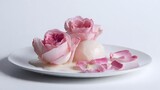 Elegant dessert presentation featu fresh pink roses delicately arranged around a scoop of creamy sorbet on a pristine white plate, creating a visually stunning scene.