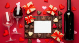 Valentine's Day celebration with wine, chocolates, gifts, and heart decorations