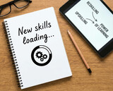 New skills upskilling learning future development concept digital notebook on table with tablet and pencil showing power of learning idea for workforce growth Upskilling for future skills