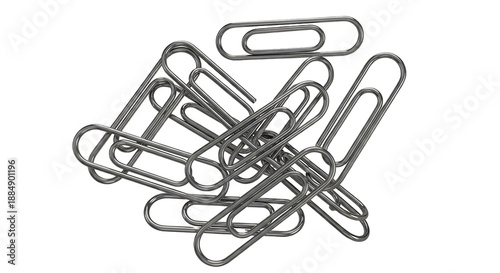 A pile of metal paper clips on a black background