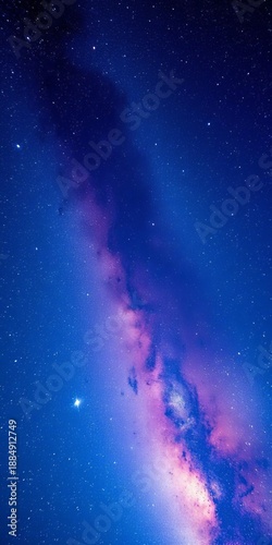 A vibrant, starry night sky showcases the majestic Milky Way, its bright core accented by a subtle, ethereal purple glow, hinting at the vast universe,  deep space,  stellar