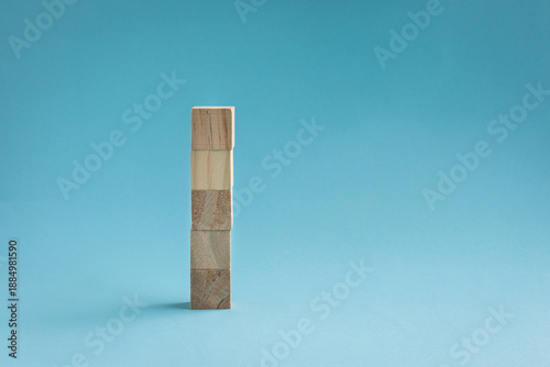 Принти на полотні 5 blank square wood blocks stacked up, isolated on light blue background
