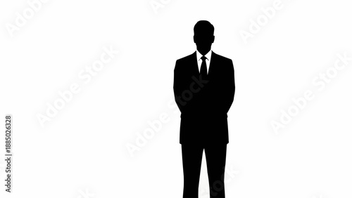 Silhouette of a man in a suit standing formally.