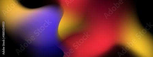 Warm red and yellow tones blending with deep blue into a soft out of focus abstract composition