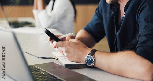 Fotografie Man, hands and typing in office with phone, text message and laptop for social media marketing campaign