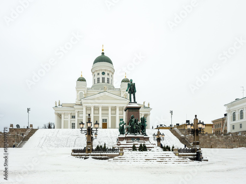 Helsinki, Finland – Winter view of Helsinki Cathedral, with snow-covered steps and neoclassical facade, in Senate Square (Senaatintori).
