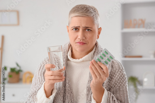 Sick mature woman with glas...
