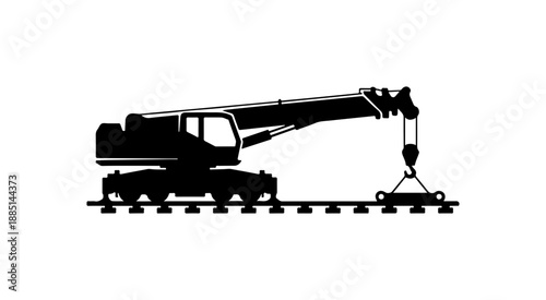 Industrial Crane Silhouette on Railroad Tracks