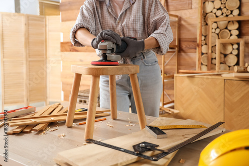 Young female carpenter poli...