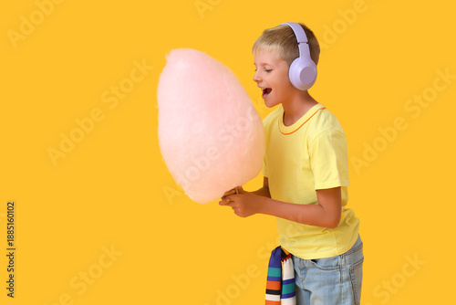 Teen boy in headphones eati...