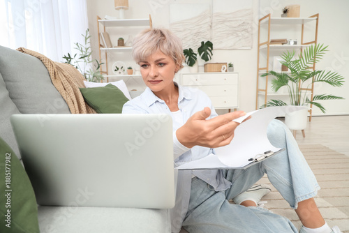 Mature woman with clipboard...