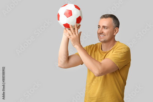 Handsome mature man playing...