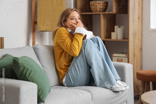 Scared mature woman at home