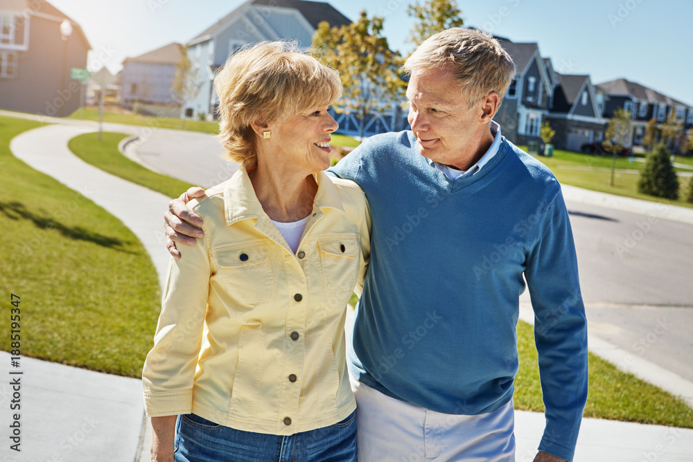 Naklejka premium Love, senior couple and walking in neighborhood for fresh air, bonding together or retirement support. Happy, elderly people and hug with romantic stroll outdoor for connection, wellness or affection