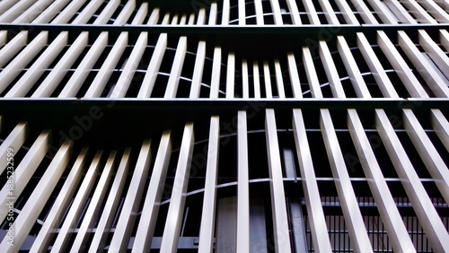 Exterior metal screens in a wave pattern on a building facade
