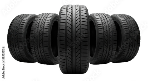 Five high-performance matte black car tires with symmetrical tread isolated on a white studio background. Concept for automotive advertising