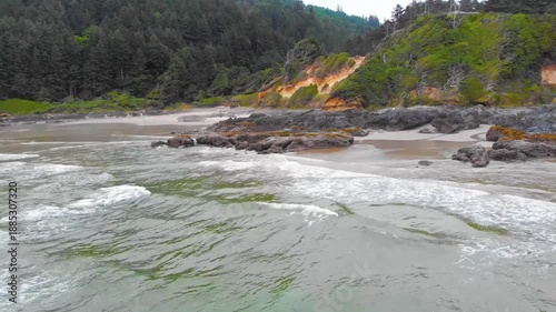 A wide-angle, low-angle shot captures the raw beauty of the central Oregon coast at the Cape Perpetua Scenic Area, near the town of Yachats.