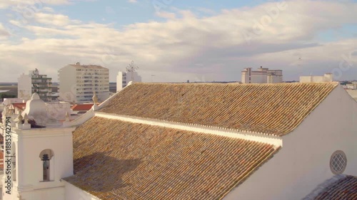 Aerial View of Sé de Faro Cathedral in Portugal with Birds in the Sky
