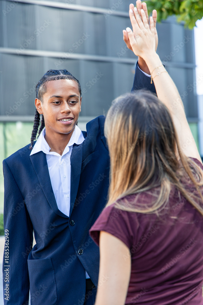 Fototapeta premium multicultural Business partners giving high five celebrating success in the financial district
