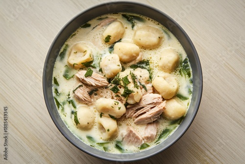 A photo of a bowl filled with creamy chicken gnocchi