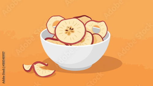 A white bowl brimming with sliced, dehydrated fruit sits on an orange surface
