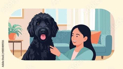 A woman gently pets her large black dog in a cozy room