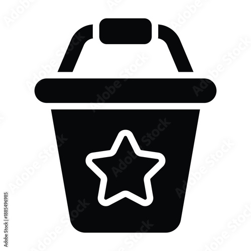 Solid black illustration of a sand bucket with star detail. Bold glyph style suitable for beach play, sandbox activities, and childhood learning visuals on white background.