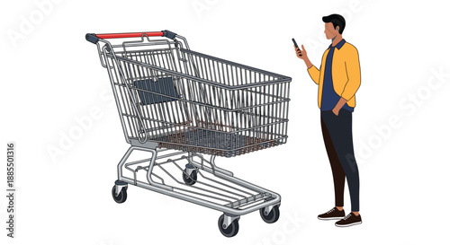 Young man looking at his smartphone while standing next to a large empty metal shopping cart on white background.