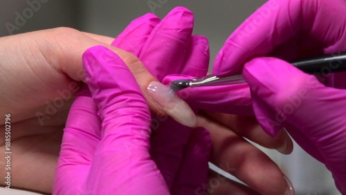 Canvas Print Closeup Acrylic Nail Sculpting With Brush And Pink Gloves Applying Builder Material For Extension